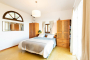 Ground floor bedroom with doors to terraces